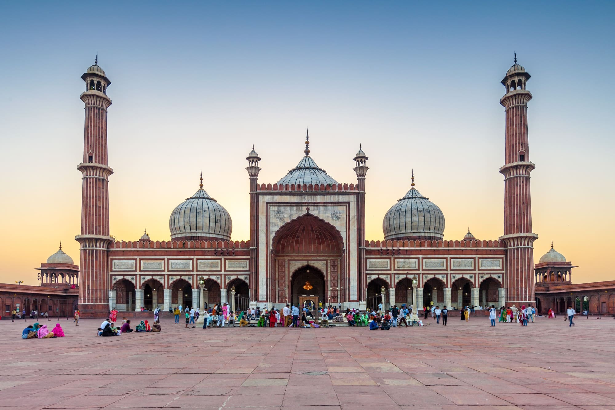 The front gateway and domes of Jama Masjid seen from its courtyard