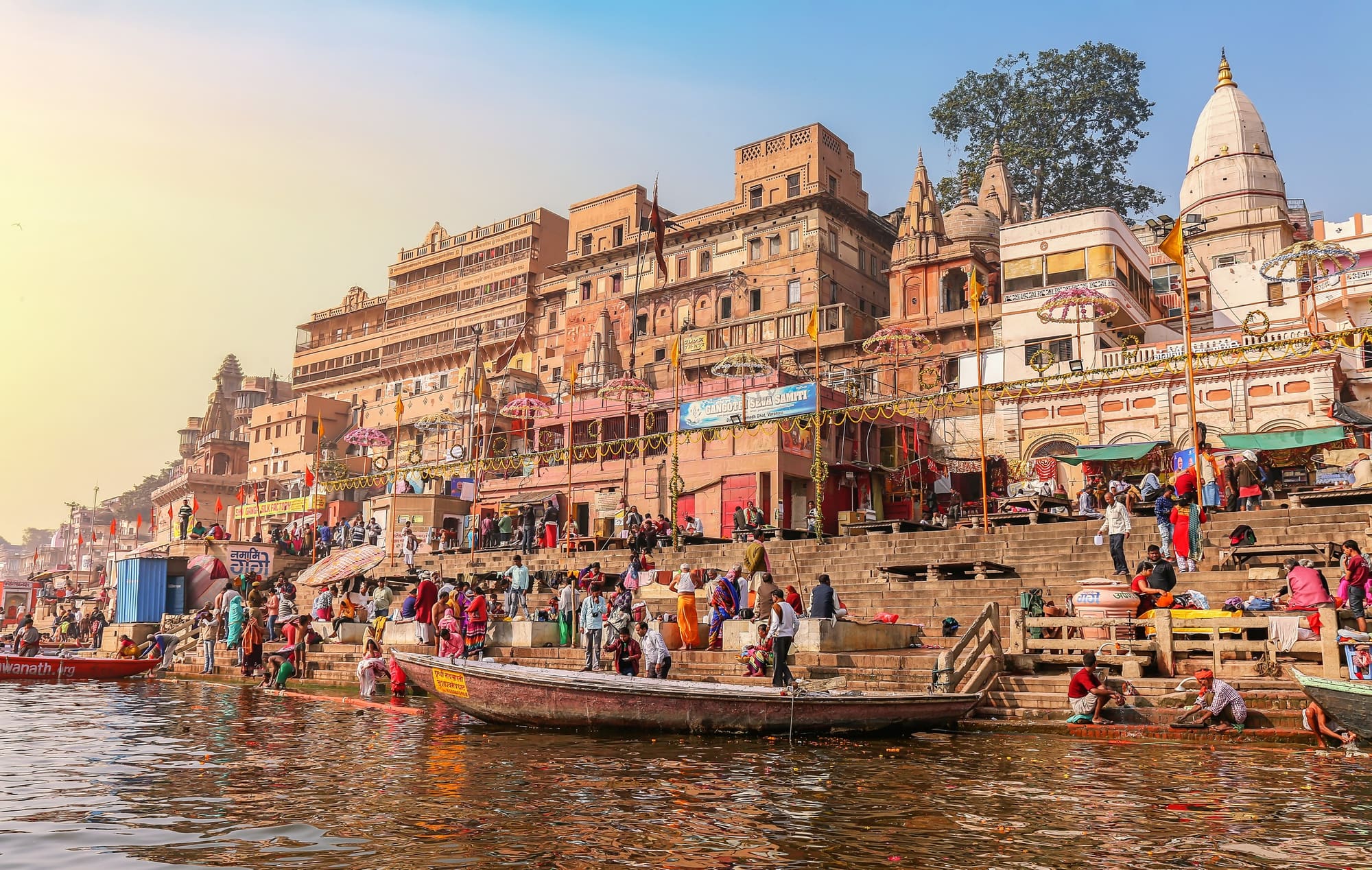 The ghats of Varanasi stepping down to the Ganges with boats moored below